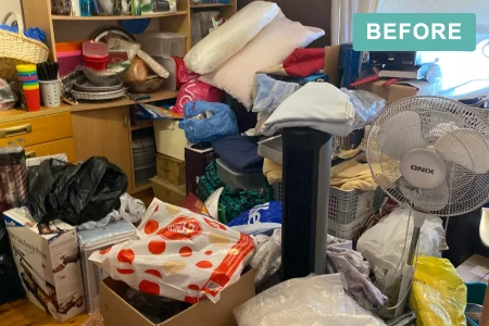 Living room full of belongings before a deceased estate clearance by Declutter Assistance